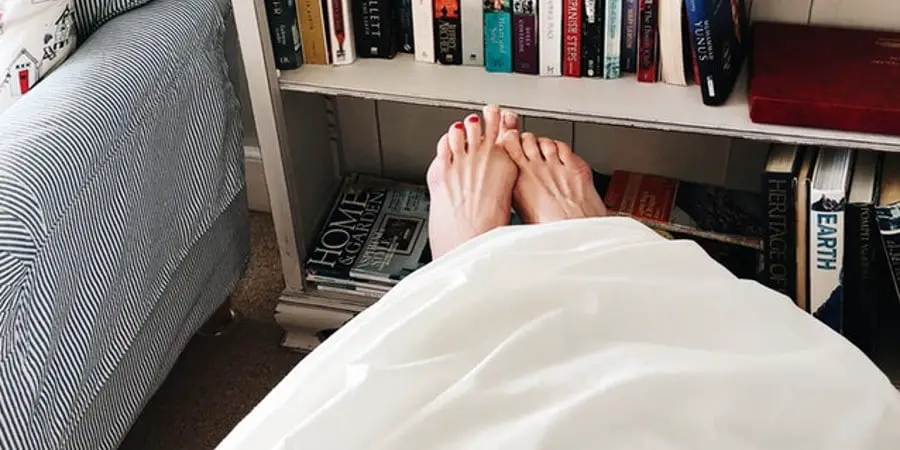 Feet Hanging off the Bed