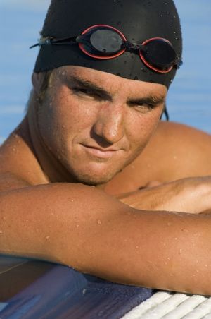 Swimming cap to earplug alternative